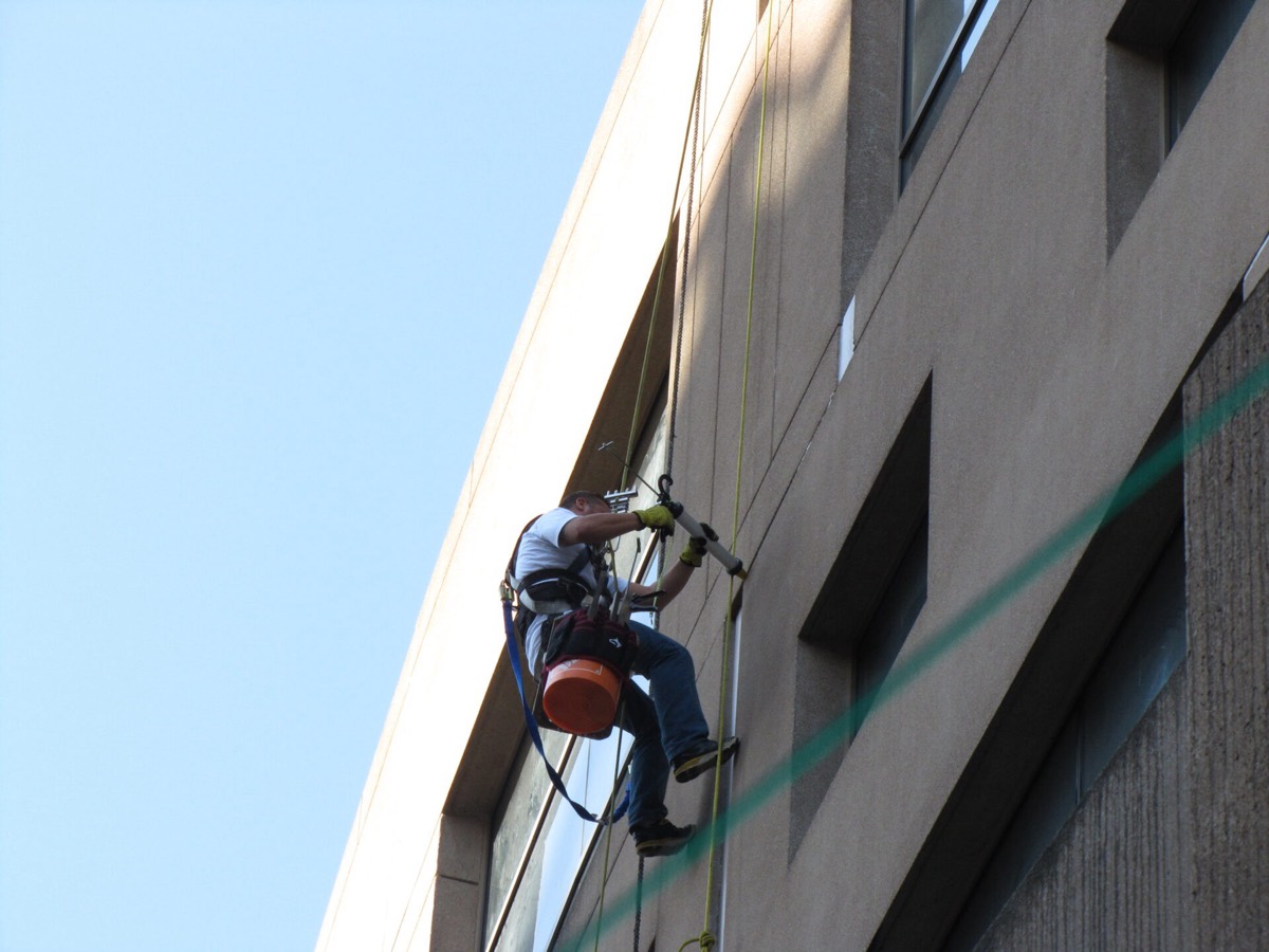 Building envelope work from swing stage