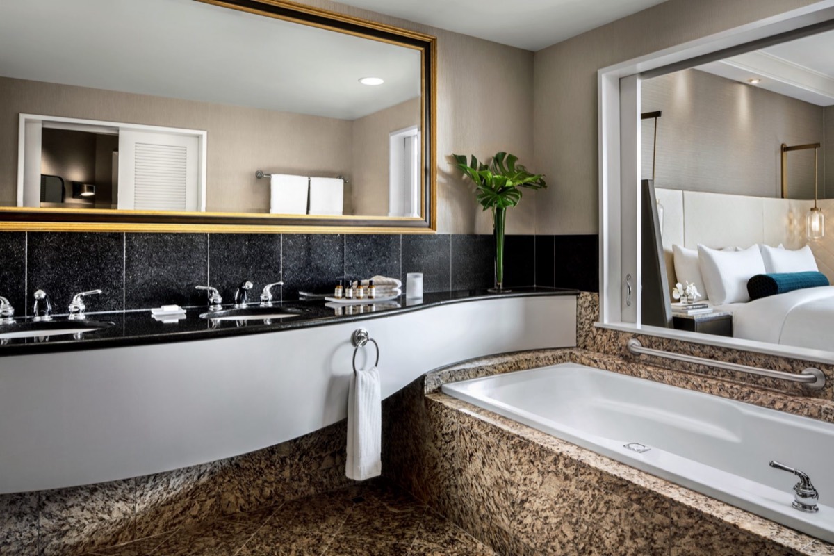 Plumbing and mechanical work in a hotel bathroom